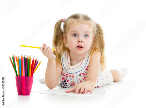 Photo: Cute girl drawing a picture with color pencils Cute girl drawing a picture with color pencils
