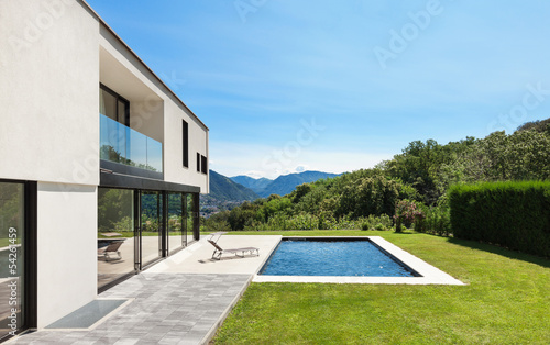 Photo: Modern villa with pool, view from the garden Modern villa with pool, view from the garden