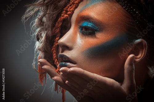 Photo: portrait of a beautiful young woman portrait of a beautiful young woman