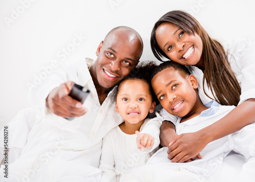 Photo: Family watching tv Family watching tv