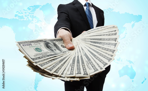 Photo: Business Man Displaying Spread of Cash Business Man Displaying Spread of Cash