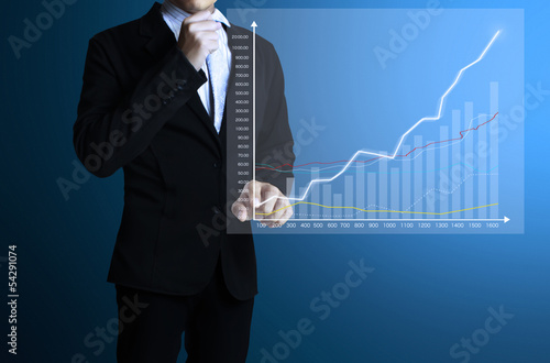 Photo: businessman with financial symbols coming businessman with financial symbols coming