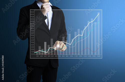 Photo: businessman with financial symbols coming businessman with financial symbols coming