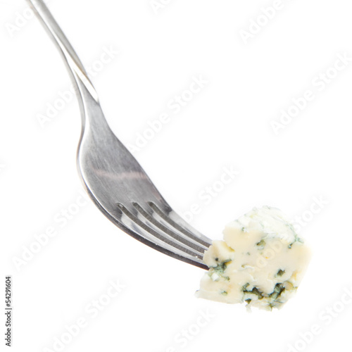 Photo: Blue cheese with a noble mould on fork on white background Blue cheese with a noble mould on fork on white background