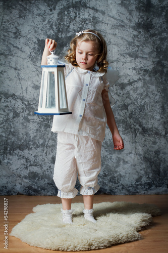 Photo: little girl play with flashlight little girl play with flashlight