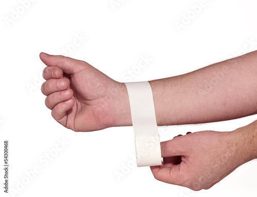 Photo: white medicine bandage on wrist. white medicine bandage on wrist.
