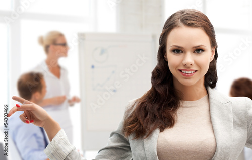Photo: attractive young businesswoman in office attractive young businesswoman in office