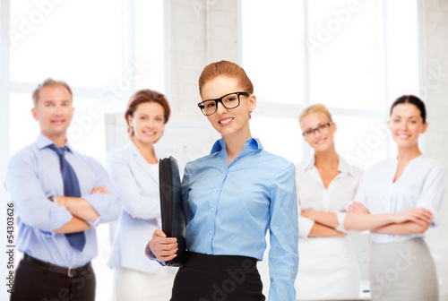 Photo: businesswoman with tablet pc in office businesswoman with tablet pc in office