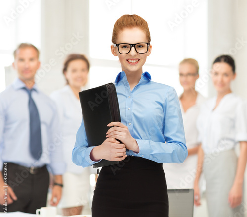 Photo: businesswoman with tablet pc in office businesswoman with tablet pc in office