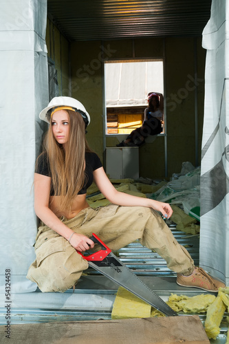Photo: portrait of woman on construction site portrait of woman on construction site
