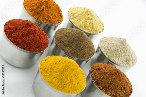 Photo: Spices in silver jars, isolated on white background Spices in silver jars, isolated on white background