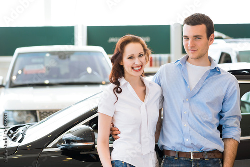 Photo: Young couple in the showroom Young couple in the showroom