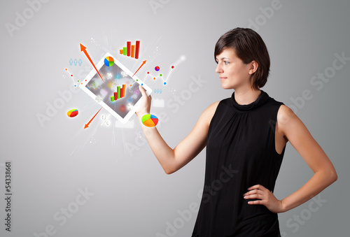 Photo: woman holding modern tablet with colorful diagrams and graphs woman holding modern tablet with colorful diagrams and graphs