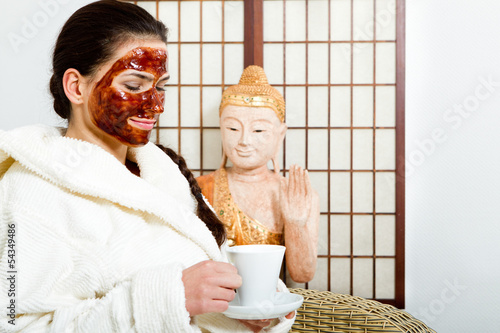 Photo: young woman with chocolate face mask young woman with chocolate face mask