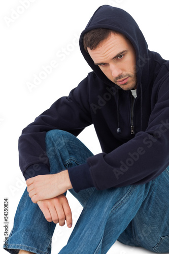Photo: Portrait of a sad man sitting Portrait of a sad man sitting