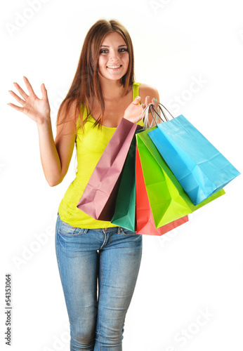 Photo: Young happy woman with colorful paper shopping bags isolated Young happy woman with colorful paper shopping bags isolated