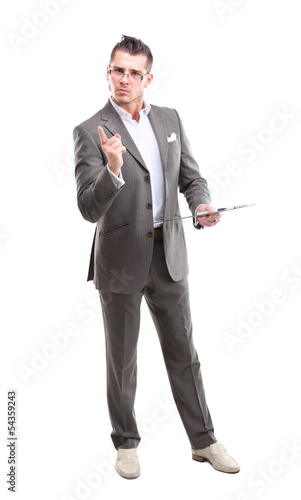 Photo: Portrait of a smiling man pointing his finger on the copyspace Portrait of a smiling man pointing his finger on the copyspace
