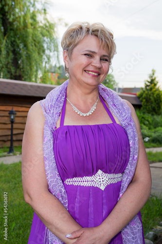 Photo: portrait of beatiful well-dressed mid-age woman portrait of beatiful well-dressed mid-age woman