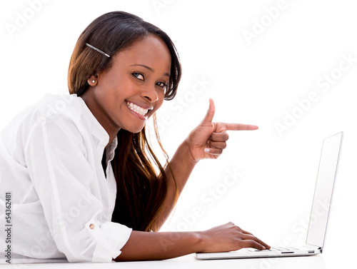 Photo: Woman pointing at a laptop Woman pointing at a laptop