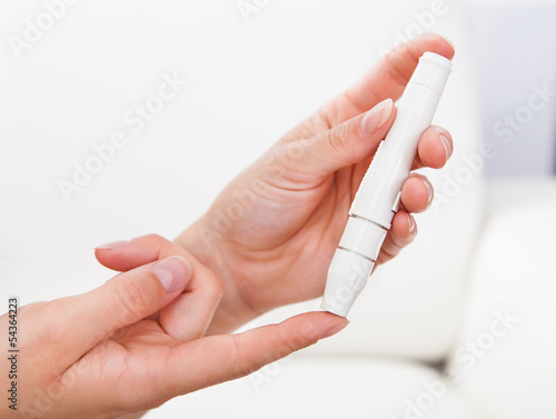 Photo: Blood sugar level testing machine Blood sugar level testing machine