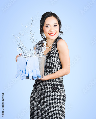 Photo: Attractive young woman holding cleaning equipment Attractive young woman holding cleaning equipment