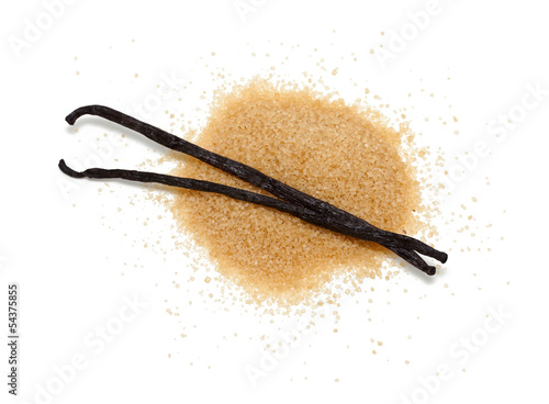 Photo: vanilla beans and brown vanilla sugar isolated on white backgrou vanilla beans and brown vanilla sugar isolated on white backgrou