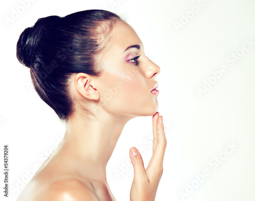 Photo: Beauty Portrait. Beautiful Spa Woman Touching her Face Beauty Portrait. Beautiful Spa Woman Touching her Face
