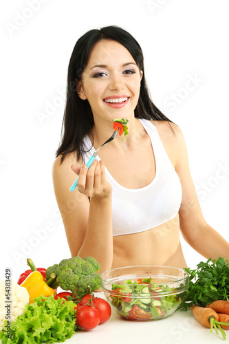 Photo: Girl with vegetables isolated on white Girl with vegetables isolated on white
