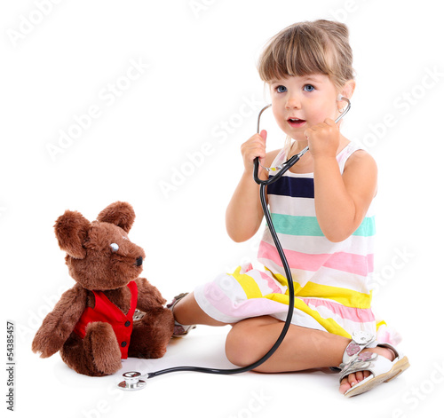 Photo: Little cute girl playing doctor, isolated on white Little cute girl playing doctor, isolated on white