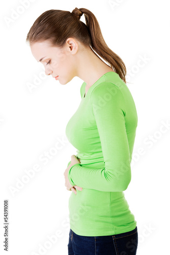 Photo: Young woman with stomach issues Young woman with stomach issues