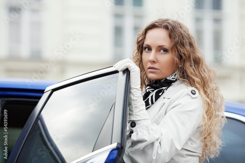 Photo: Sad beautiful woman at the car Sad beautiful woman at the car