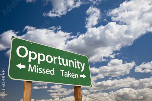 Photo: Opportunity Missed and Taken Green Road Sign and Clouds Opportunity Missed and Taken Green Road Sign and Clouds