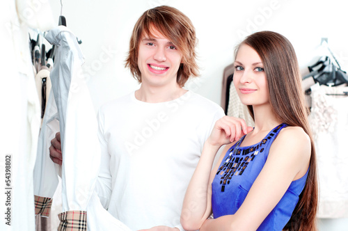 Photo: Shopping smile couple at the mall Shopping smile couple at the mall