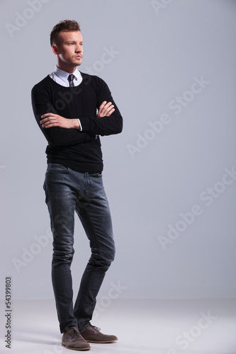 Photo: casual man stands with hands folded casual man stands with hands folded