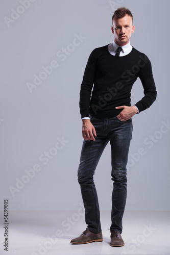 Photo: casual man standing with hand in pocket casual man standing with hand in pocket