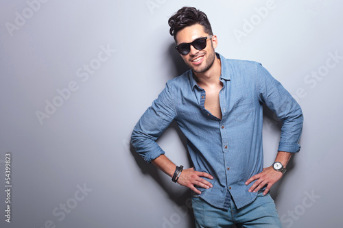Photo: casual man stands with hands on hips casual man stands with hands on hips