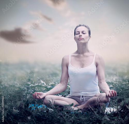 Photo: Meditation Woman. Yoga outdoor Meditation Woman. Yoga outdoor