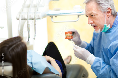 Photo: Dentist with a patient in his studio Dentist with a patient in his studio