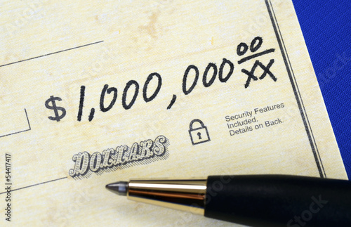 Photo: Write a check of one million dollars concept of wealth Write a check of one million dollars concept of wealth