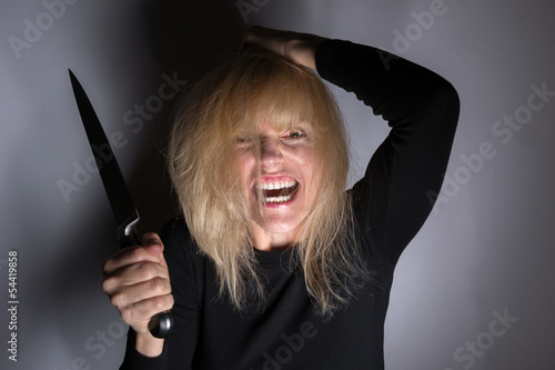 Photo: Psychotic Woman with Knife Psychotic Woman with Knife
