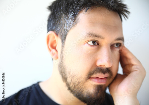 Photo: young man thinking young man thinking