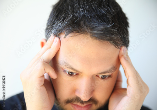 Photo: temple headache pain in young man temple headache pain in young man
