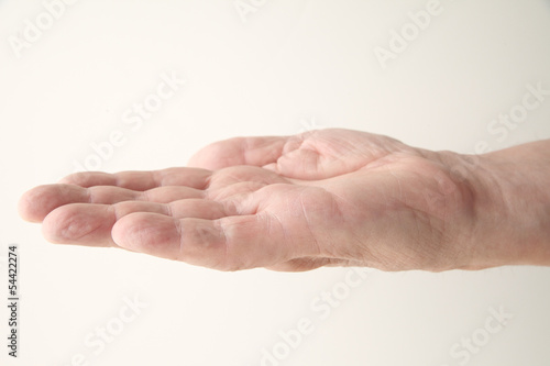 Photo: man holds his hand palm up man holds his hand palm up
