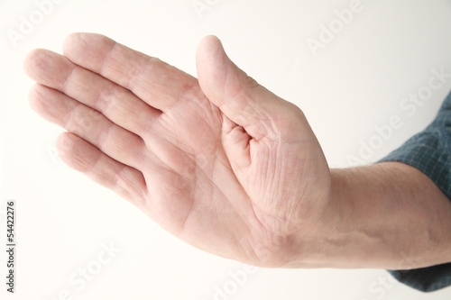 Photo: older man holding a hand out at an angle older man holding a hand out at an angle