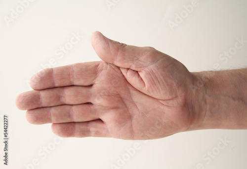 Photo: senior man extends his right hand senior man extends his right hand