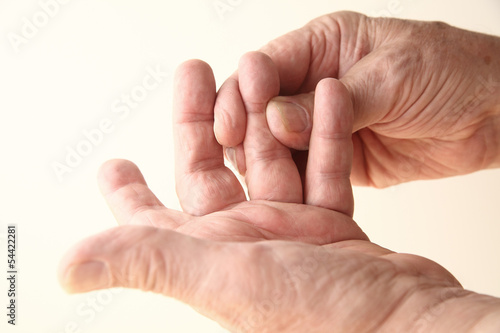 Photo: man tries to move sore finger man tries to move sore finger