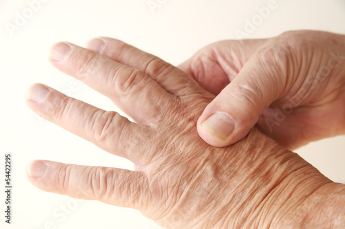 Photo: aching knuckle on older man aching knuckle on older man