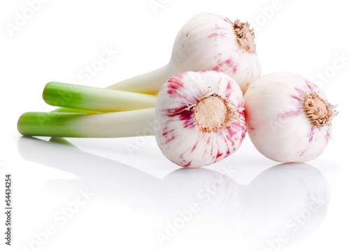 Photo: Three bulbs of fresh garlic isolated on white background Three bulbs of fresh garlic isolated on white background