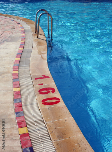 Photo: Swimming Pool with Metal Ladder and Warning Swimming Pool with Metal Ladder and Warning