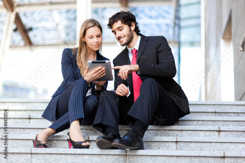 Photo: Two business people at work Two business people at work